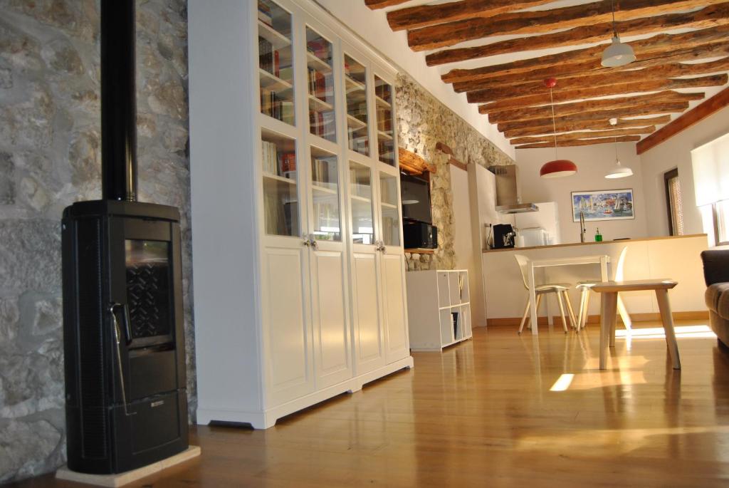 a living room with a wood stove in a room at Casa Zologorri in Ganuza