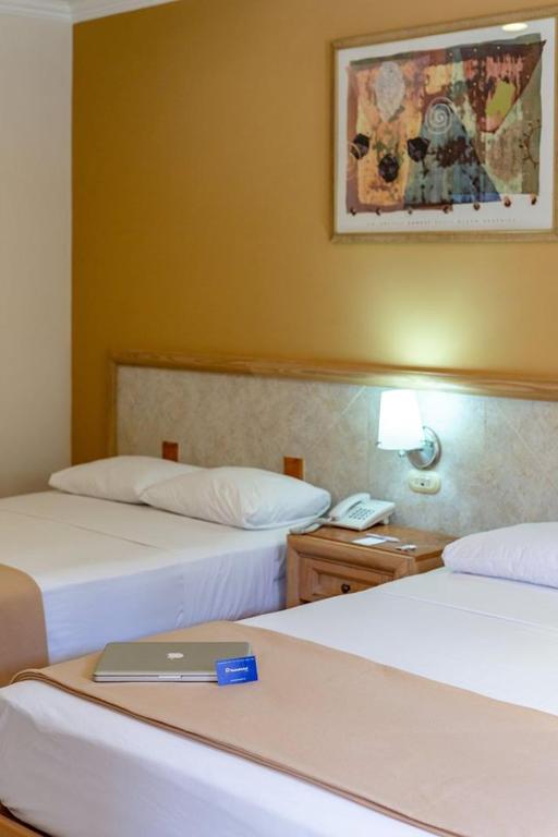 Postel nebo postele na pokoji v ubytování Tecnohotel Itzáes