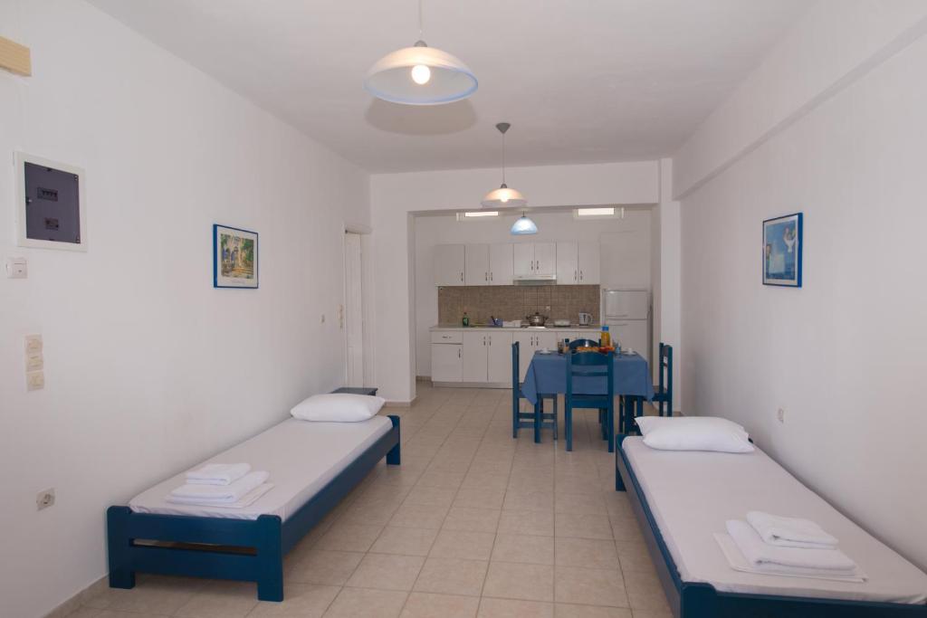 Postel nebo postele na pokoji v ubytování Nymphs Rooms & Apartments