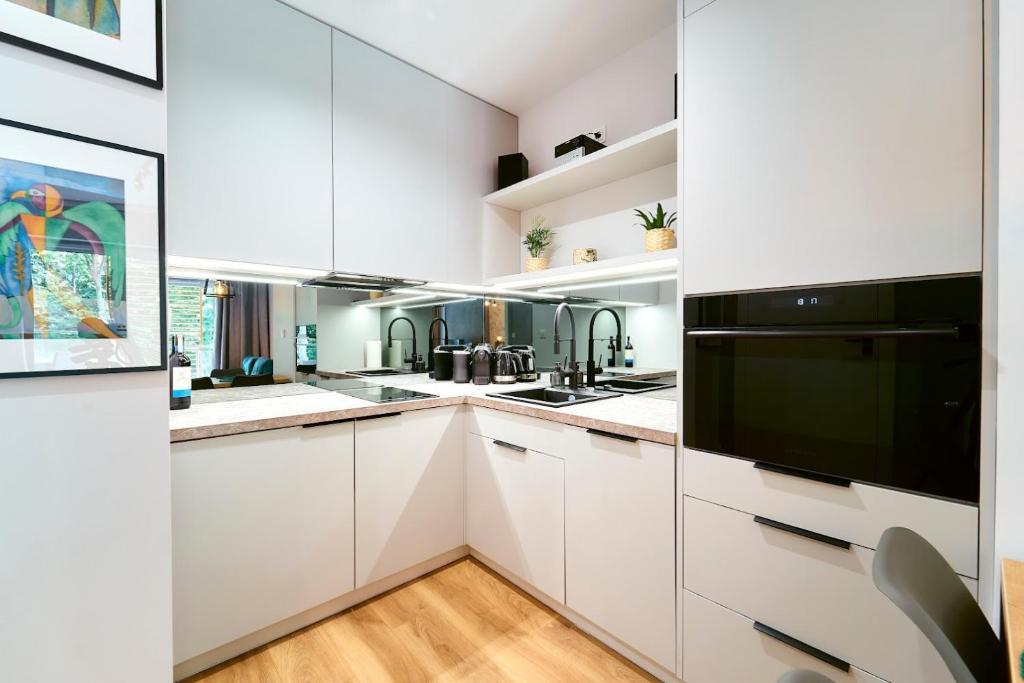 Kuchyňa alebo kuchynka v ubytovaní LAGUNA Apartament Polanica Residence 17