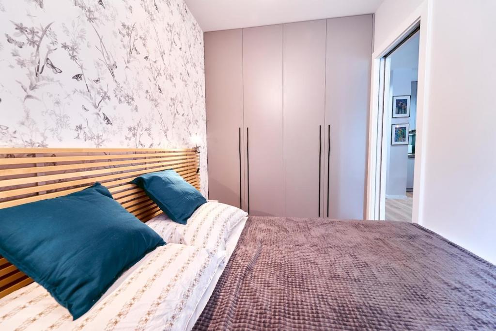 Posteľ alebo postele v izbe v ubytovaní LAGUNA Apartament Polanica Residence 17