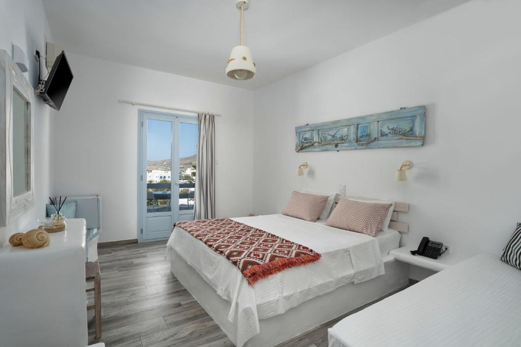 Postel nebo postele na pokoji v ubytování Hotel Iris
