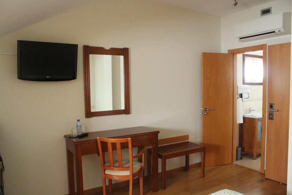 TV a/nebo společenská místnost v ubytování Guesthouse Muralhas do Mino