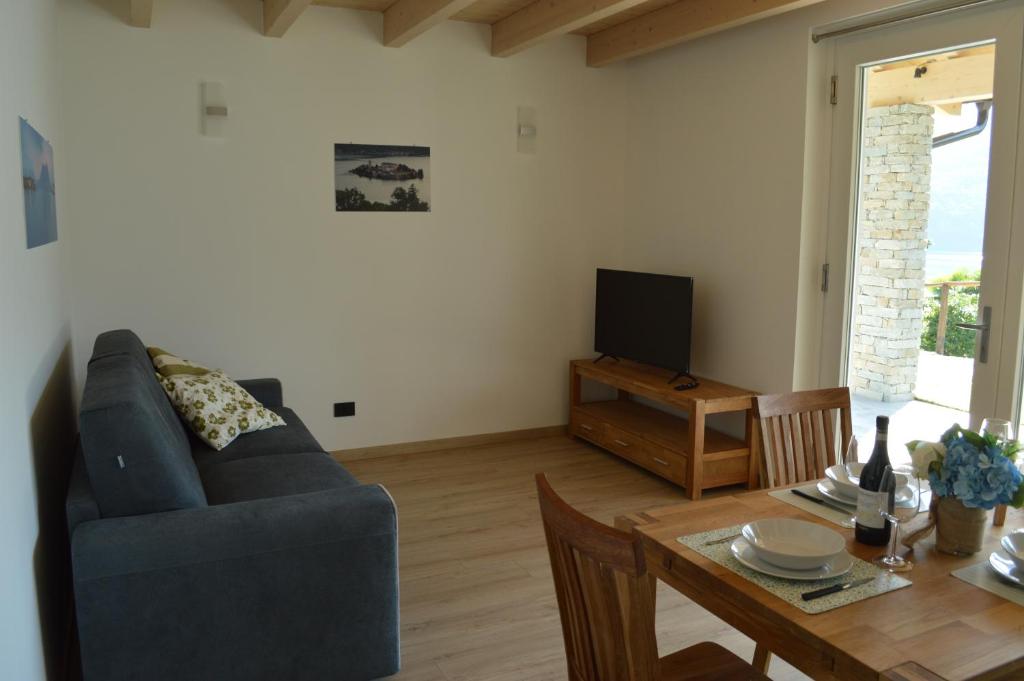 TV a/nebo společenská místnost v ubytování Residence Belvedere & Private Beach
