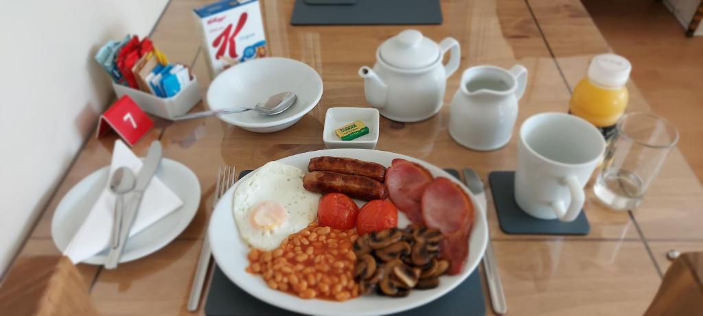 a plate of breakfast food on a table at Ivanhoe Guest House in Bridlington