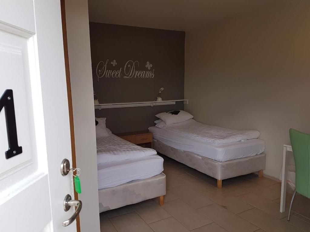Postel nebo postele na pokoji v ubytování Vinland Guesthouse