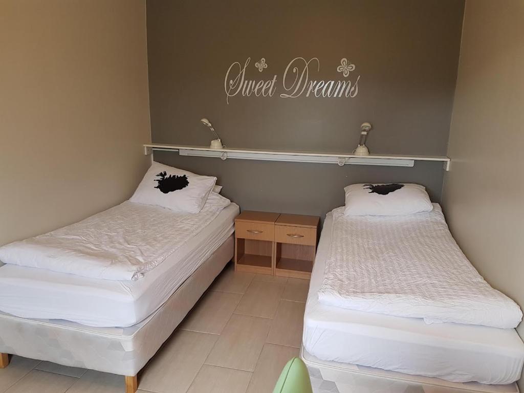 Postel nebo postele na pokoji v ubytování Vinland Guesthouse