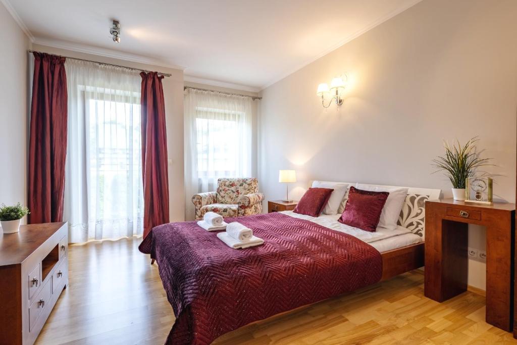 Posteľ alebo postele v izbe v ubytovaní Zakopane Apartamenty LUX