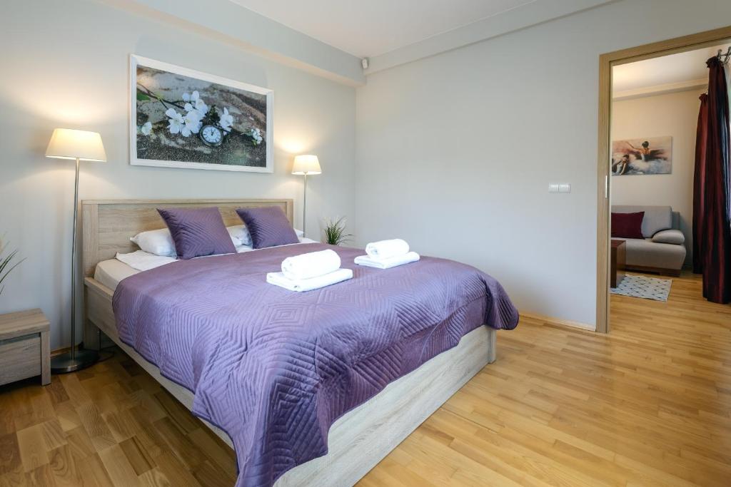 Posteľ alebo postele v izbe v ubytovaní Zakopane Apartamenty LUX