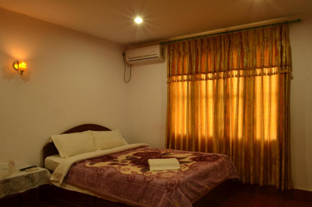 Postel nebo postele na pokoji v ubytování Hotel Hermitage