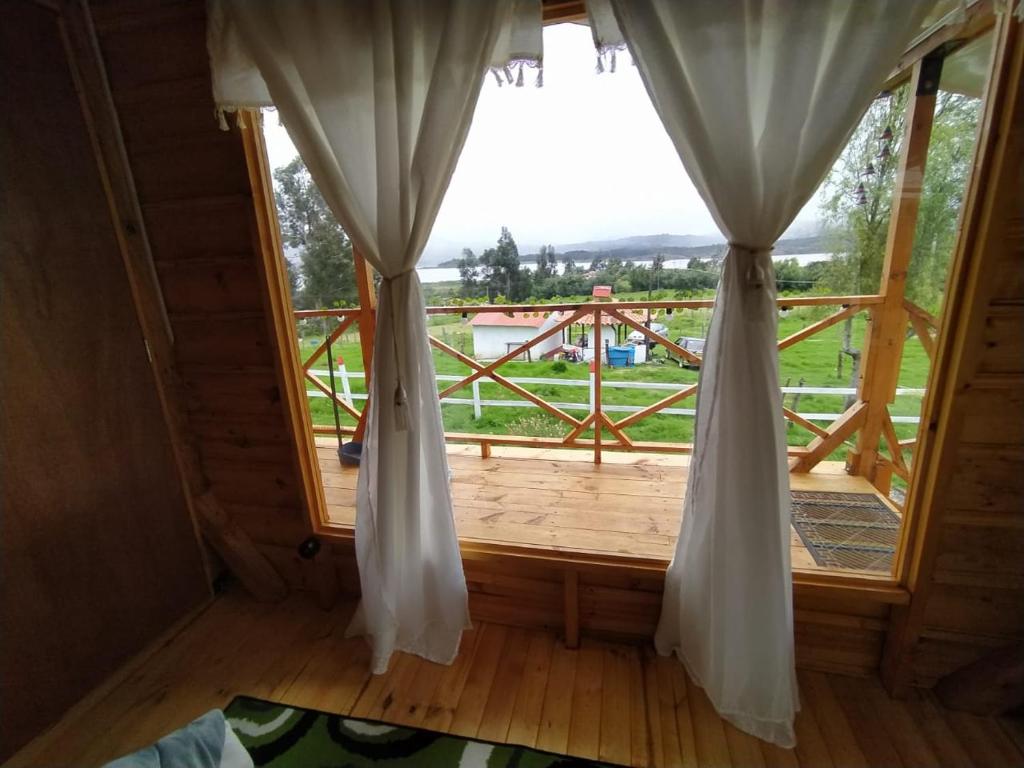 Balkón nebo terasa v ubytování Cabaña La Granja tomine