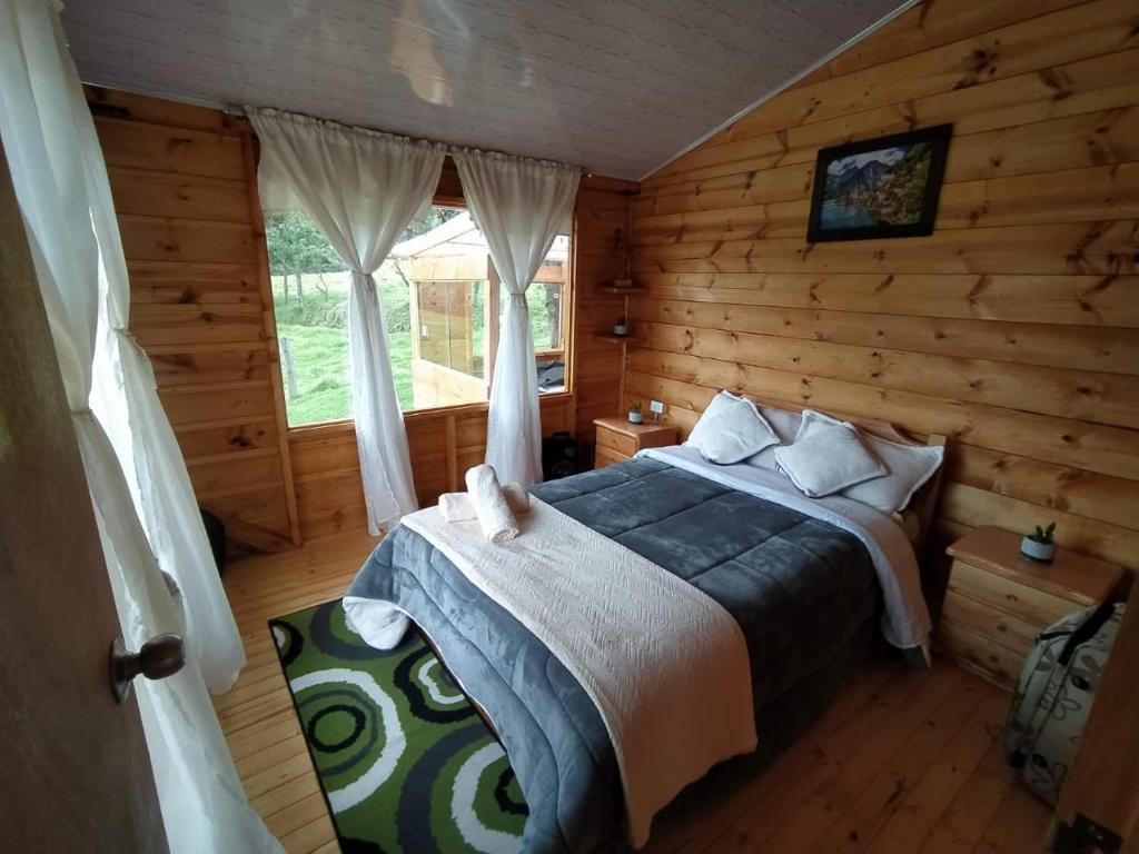 Postel nebo postele na pokoji v ubytování Cabaña La Granja tomine