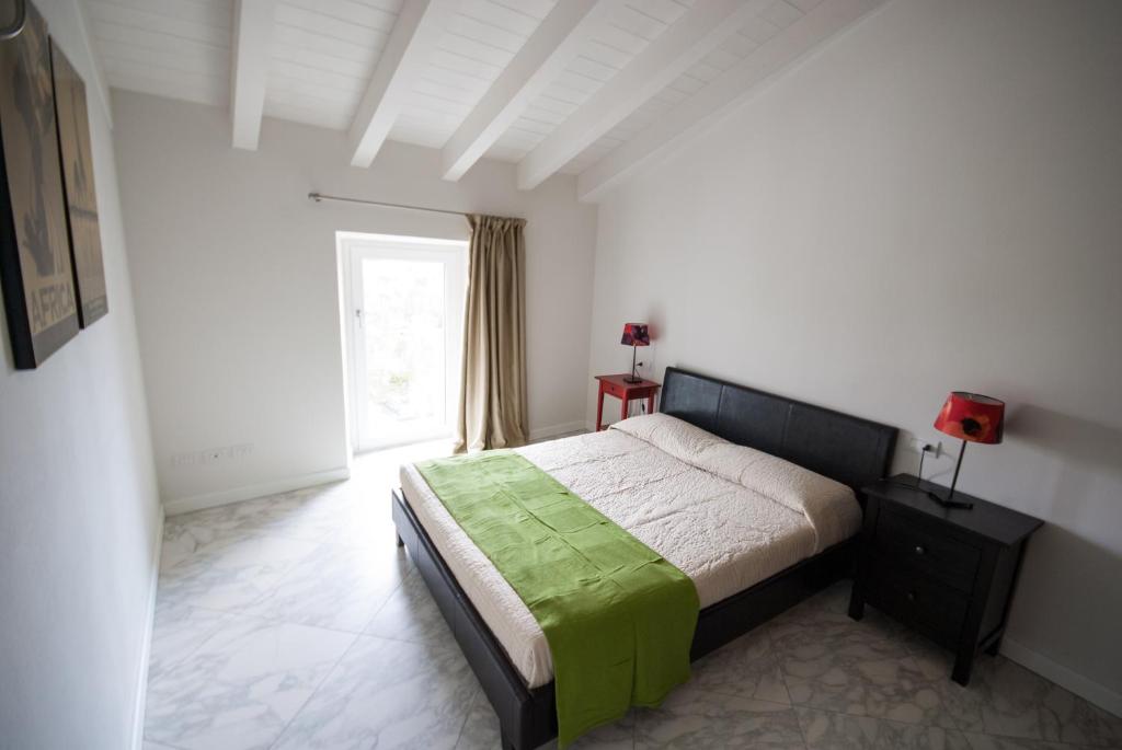 Кровать или кровати в номере Maisons Du Lac