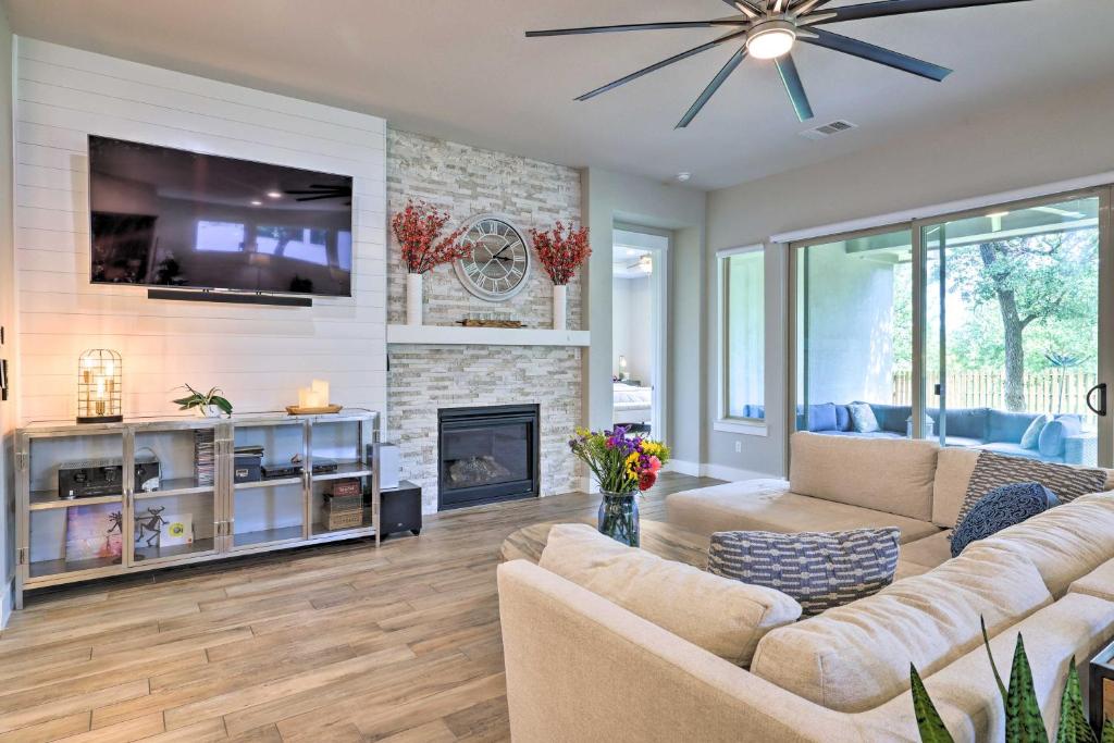 a living room with a couch and a fireplace at Upscale Austin Area Escape Families Welcome! in Austin