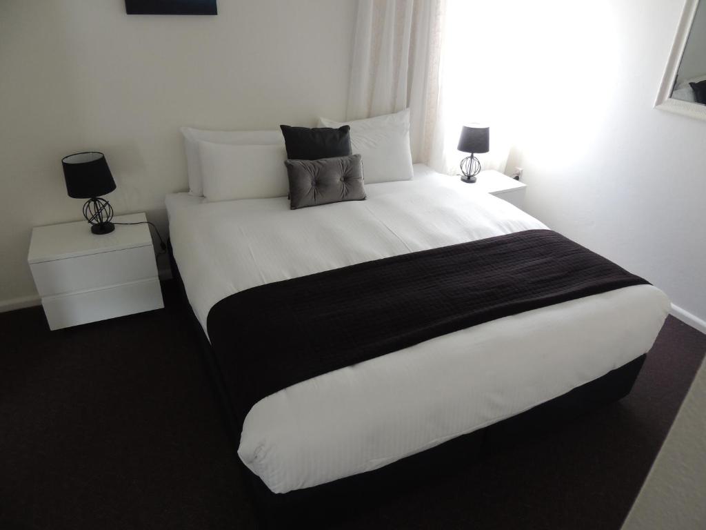 Ένα ή περισσότερα κρεβάτια σε δωμάτιο στο Comfort Inn Premier