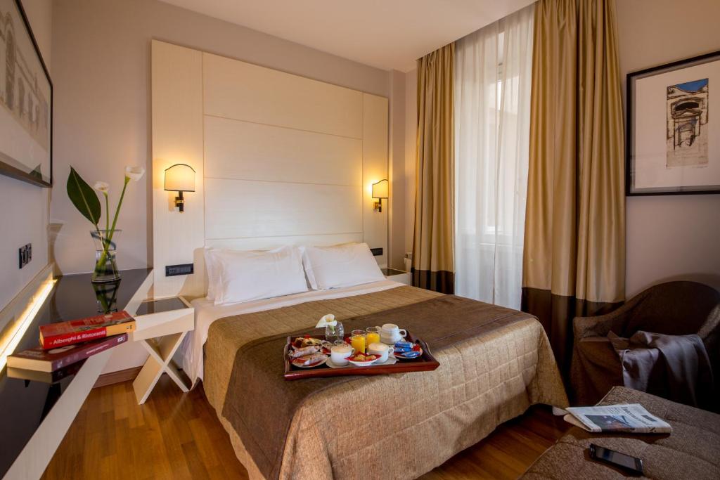 Postel nebo postele na pokoji v ubytování Hotel Oxford