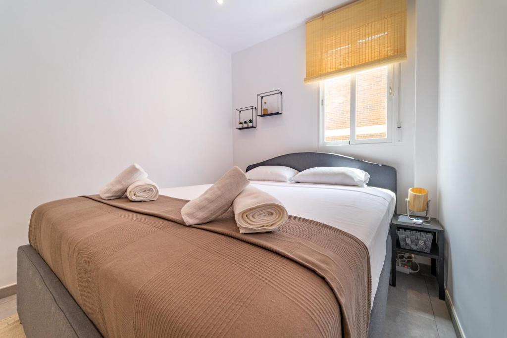 A bed or beds in a room at Myflats Premium Santa Pola