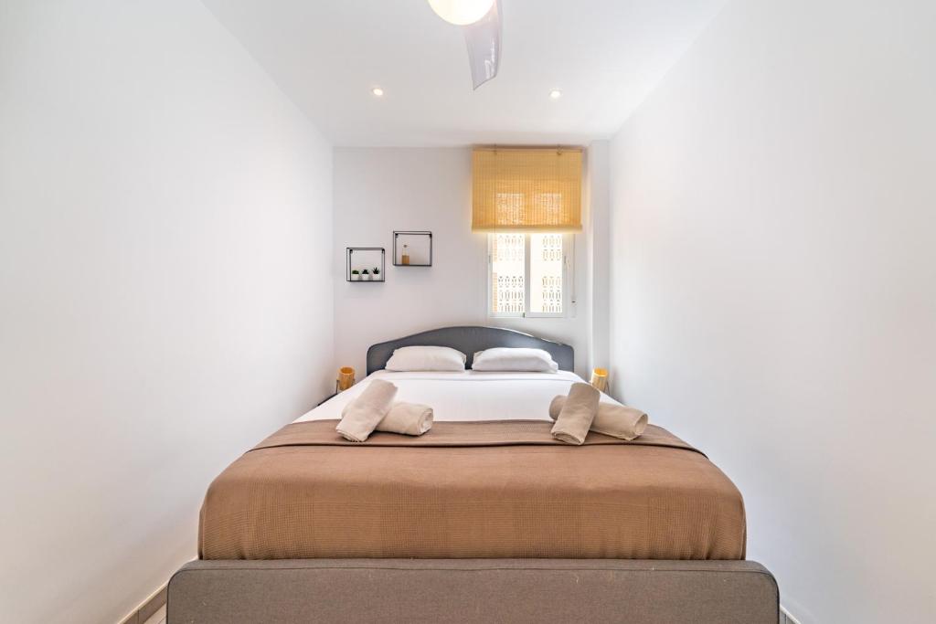 A bed or beds in a room at Myflats Premium Santa Pola