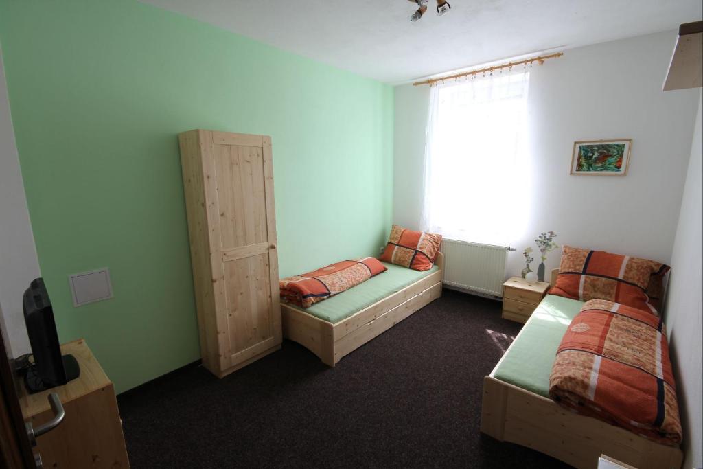 Postel nebo postele na pokoji v ubytování Penzion Malaika