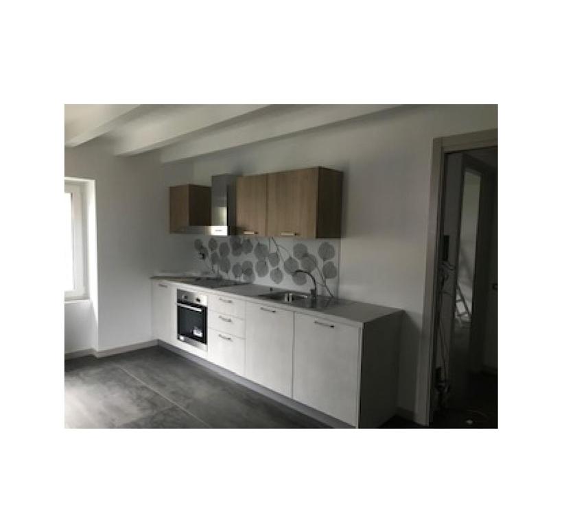 a kitchen with a sink and a counter top at Casa vacanza 1 in Serina