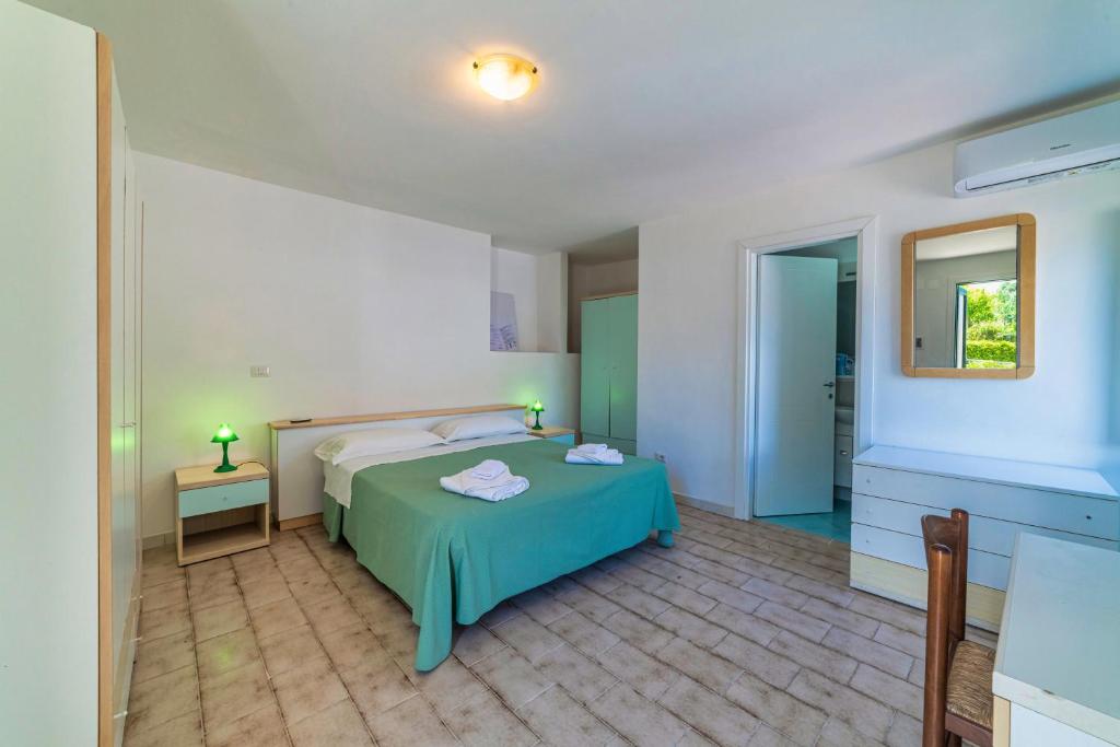 Una cama o camas en una habitación de Albergo Le Querce
