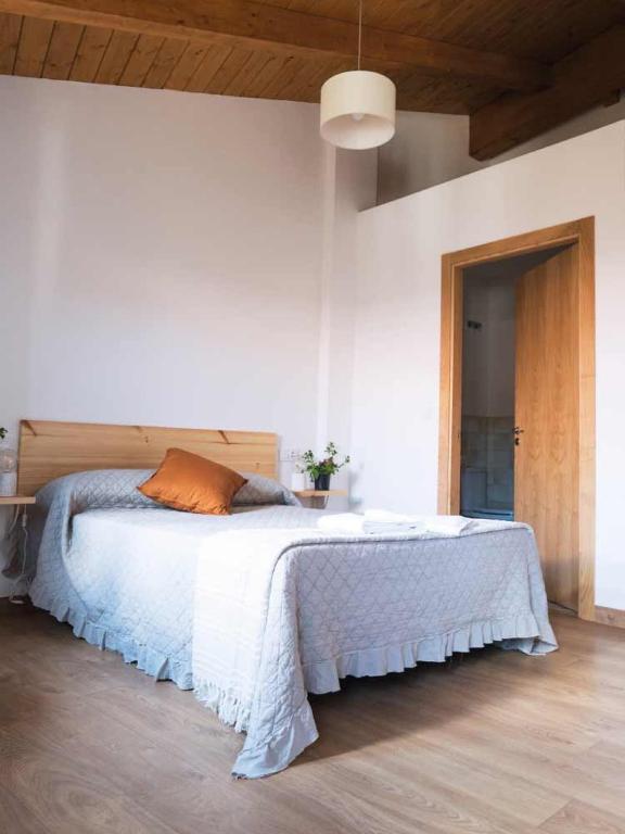 Postel nebo postele na pokoji v ubytování CASA TERRA ALMA