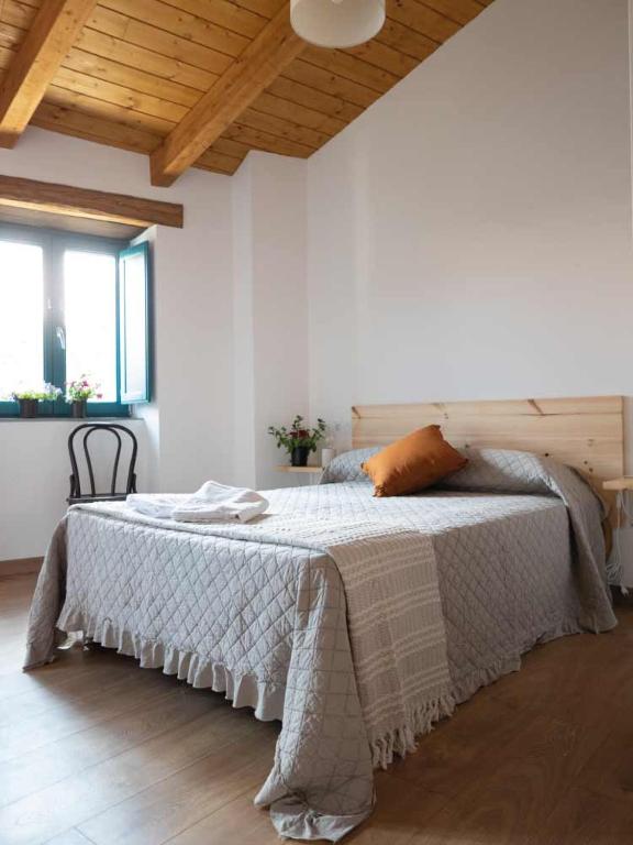 Postel nebo postele na pokoji v ubytování CASA TERRA ALMA