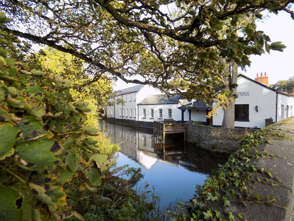 a view of a canal with houses and buildings at Flynns of Termonfeckin Boutique Hotel in Termonfeckin