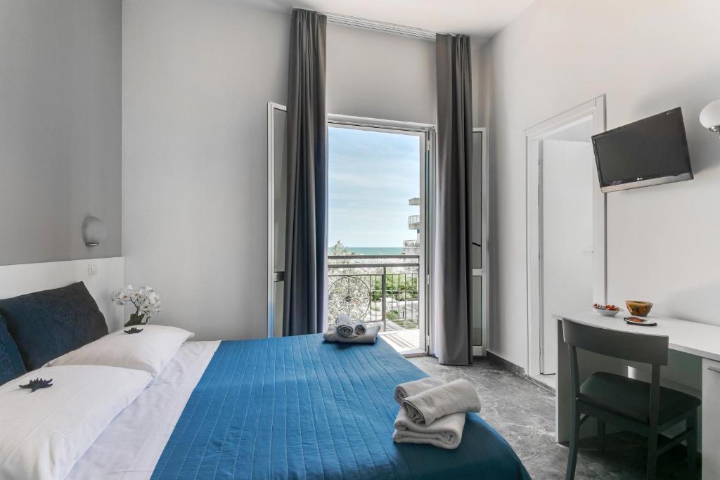 Postel nebo postele na pokoji v ubytování Hotel Quisisana