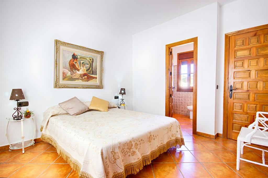 Postel nebo postele na pokoji v ubytování Hotel Rural Sierra Tejeda