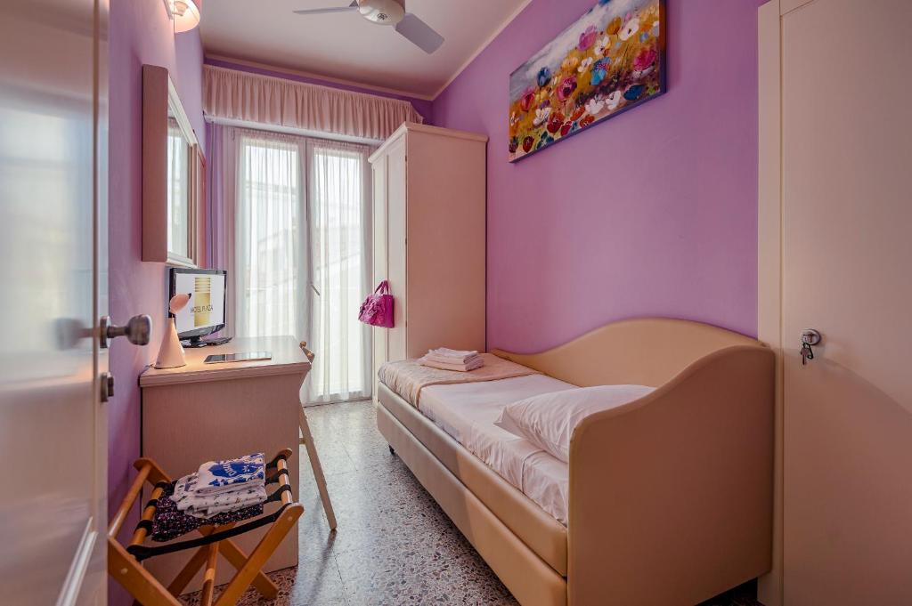 Postel nebo postele na pokoji v ubytování Hotel Plaza