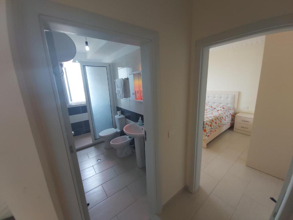 Postel nebo postele na pokoji v ubytování Shengjin-mi casa es tu casa