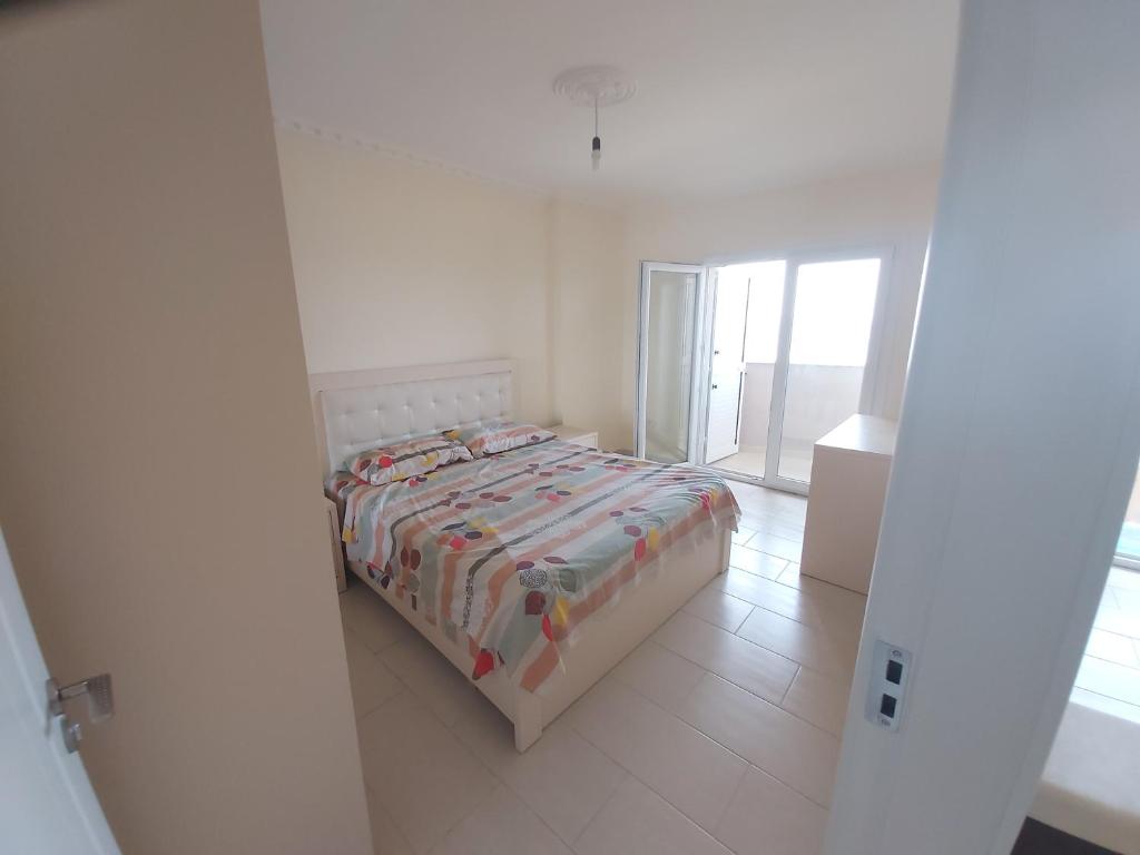 Postel nebo postele na pokoji v ubytování Shengjin-mi casa es tu casa