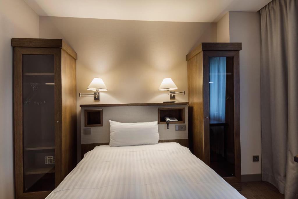 Postel nebo postele na pokoji v ubytování Hotel CH Bucharest
