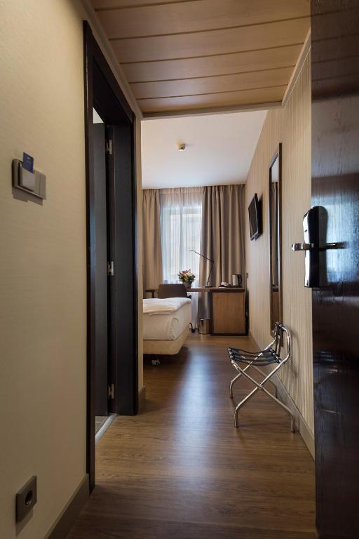 Postel nebo postele na pokoji v ubytování Hotel CH Bucharest