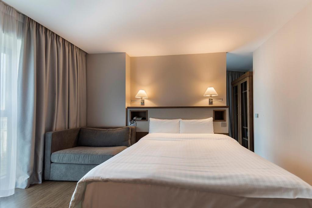 Postel nebo postele na pokoji v ubytování Hotel CH Bucharest