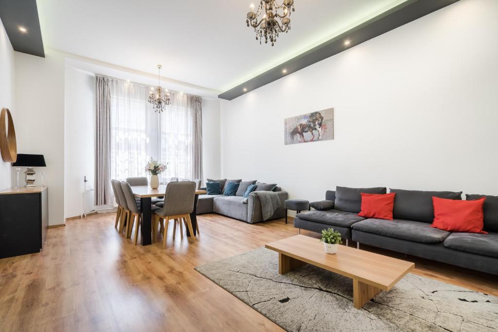 a living room with a couch and a table at Real Apartments Zichy in Budapest
