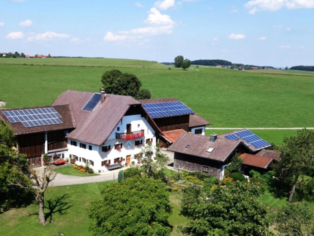 an aerial view of a house with solar panels on it at Lapperhof in Waging am See