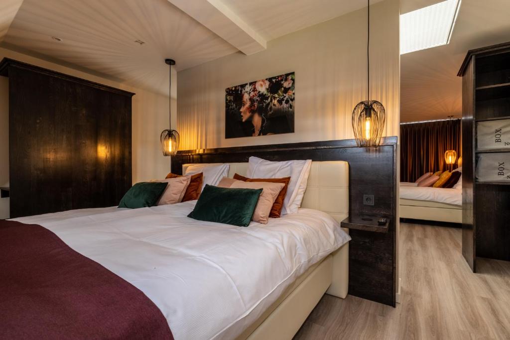 Postel nebo postele na pokoji v ubytování Anna van Chiel