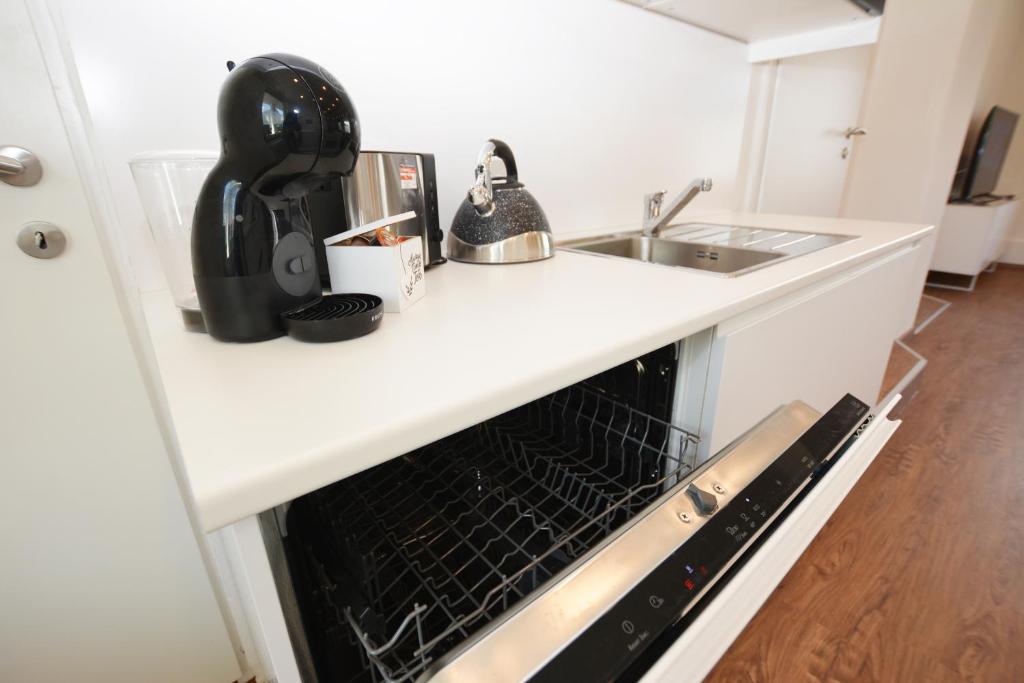 Kuchyň nebo kuchyňský kout v ubytování Alpenblick - modernes und großzügiges Apartment