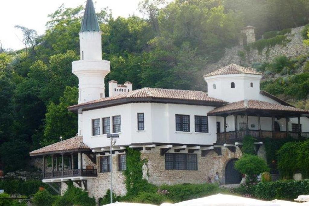 a large white house with a tower on top of it at Sunflower Villa in Tutrakantsi