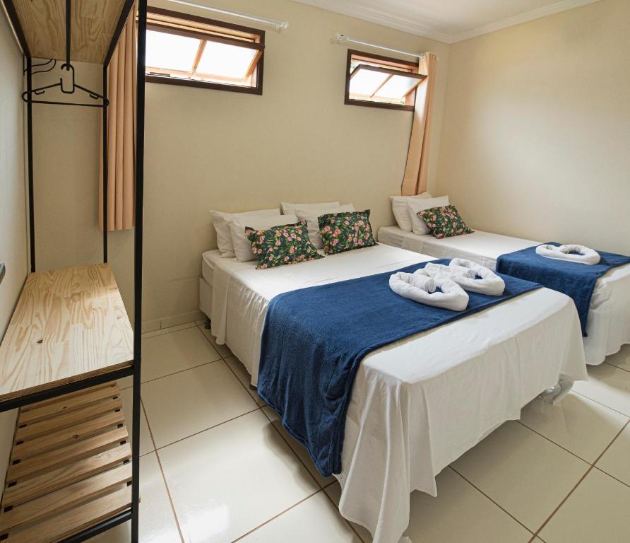 Postel nebo postele na pokoji v ubytování Village Funchal, Lençóis