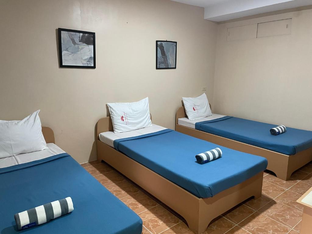 Postel nebo postele na pokoji v ubytování Your Choice Hotel