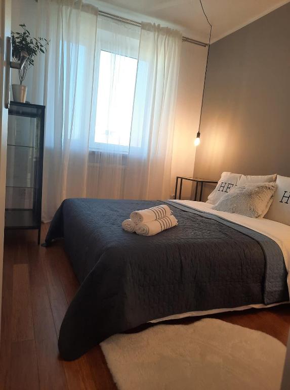 Łóżko lub łóżka w pokoju w obiekcie AnJa Apartment