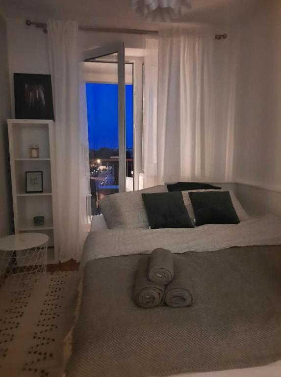 Łóżko lub łóżka w pokoju w obiekcie AnJa Apartment