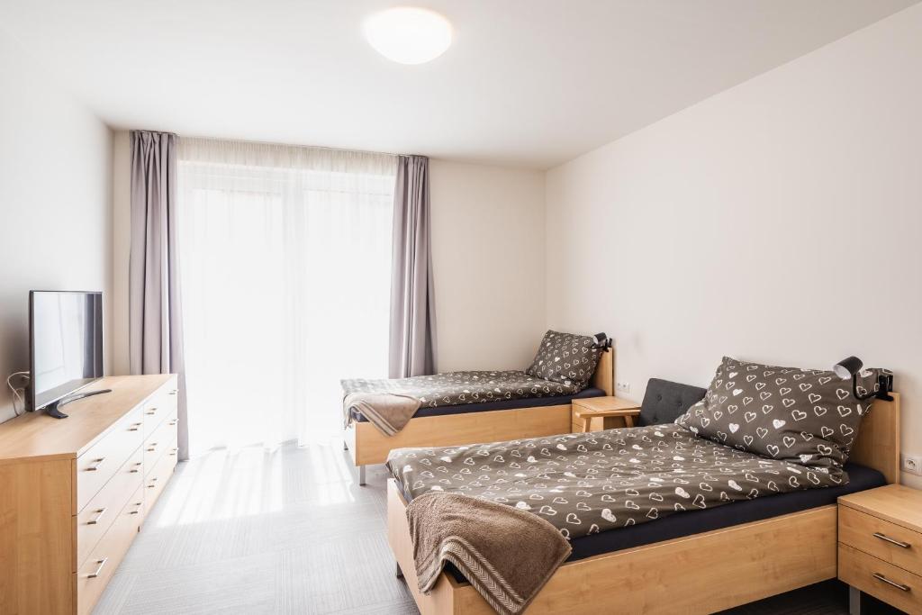 TV a/nebo společenská místnost v ubytování Kästle Residence