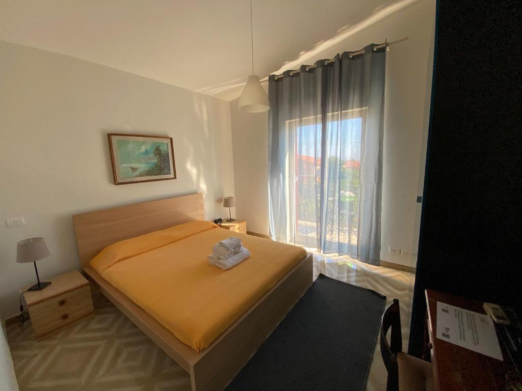 Postel nebo postele na pokoji v ubytování Terra Di Mare