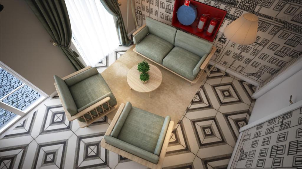 an overhead view of a living room with a table and chairs at Mouraria Lisboa Hotel in Lisbon