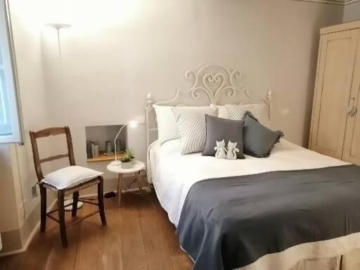 Postel nebo postele na pokoji v ubytování Noi Due a Cortona