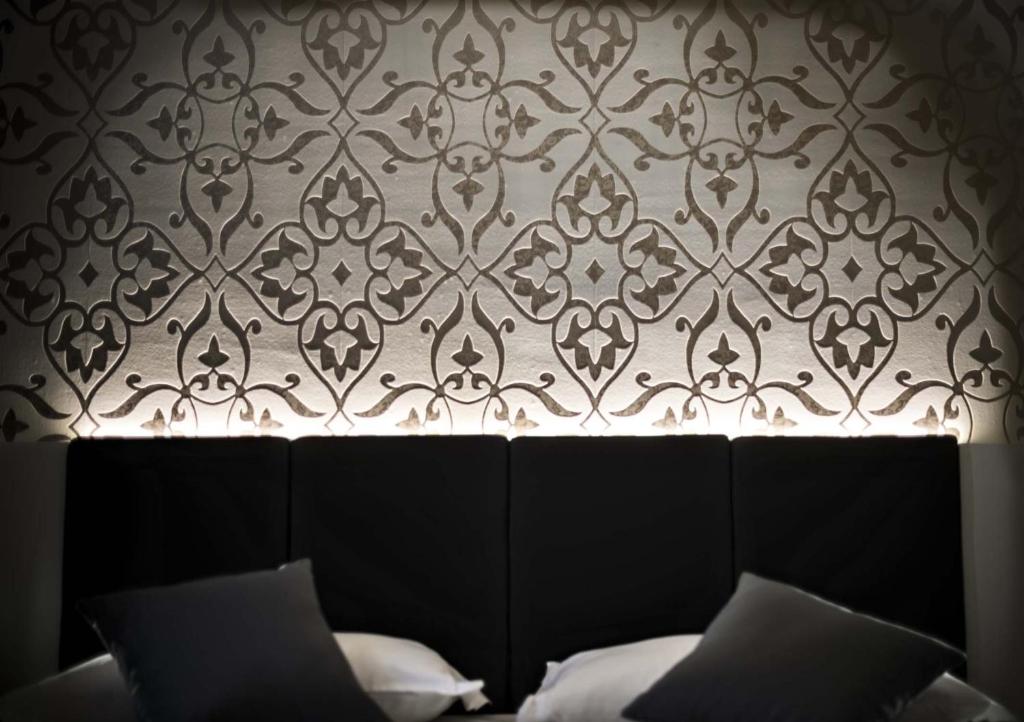 Łóżko lub łóżka w pokoju w obiekcie Ilga Hotel